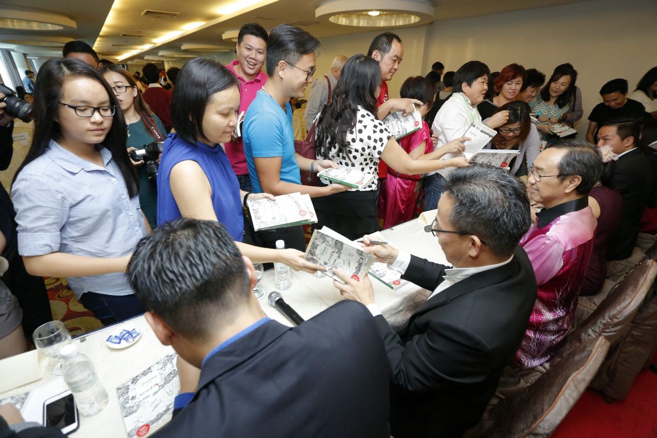 getting signatures on the book, book signature event.